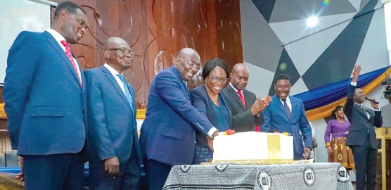 Vice-President Dr Bawumia joined by some officials of the University of Ghana Business School to cut the anniversary cake Vice-President Dr Bawumia joined by some officials of the University of Ghana Business School to cut the anniversary cake